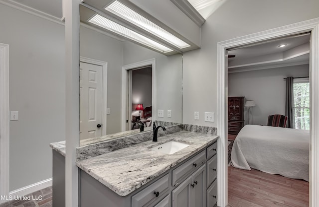 209 Lake Terrace Pl, Brandon, MS 39047 - bathroom featuring ensuite bathroom, vanity, crown molding, and wood finished floors