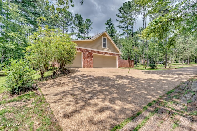 209 Lake Terrace Pl, Brandon, MS 39047 - view of front of property featuring brick siding, driveway, and a garage