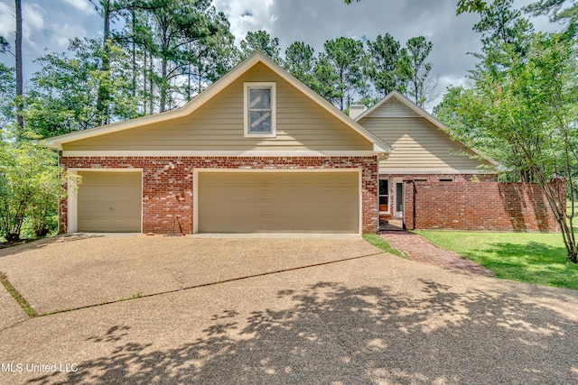 209 Lake Terrace Pl, Brandon, MS 39047 - traditional-style home with driveway, a garage, and brick siding