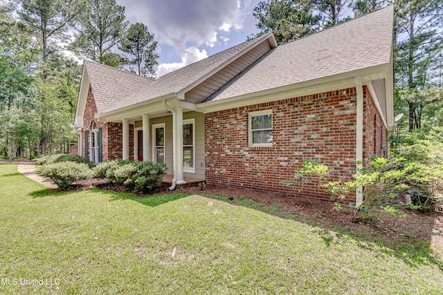 209 Lake Terrace Pl, Brandon, MS 39047 - view of front of house featuring brick siding, a front lawn, and a shingled roof