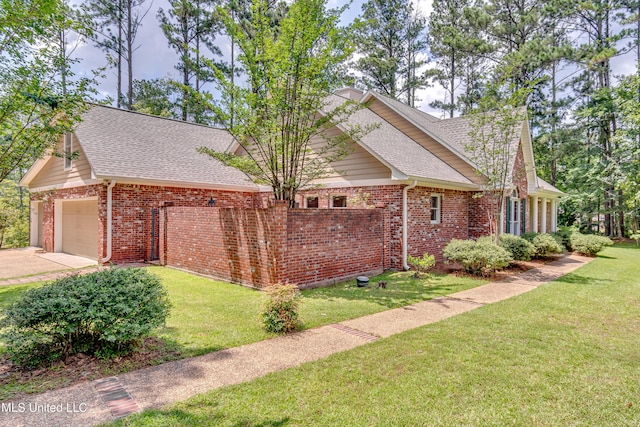 209 Lake Terrace Pl, Brandon, MS 39047 - view of side of home with brick siding, a shingled roof, a garage, a yard, and driveway