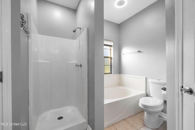 bathroom with toilet, tile patterned flooring, and plus walk in shower