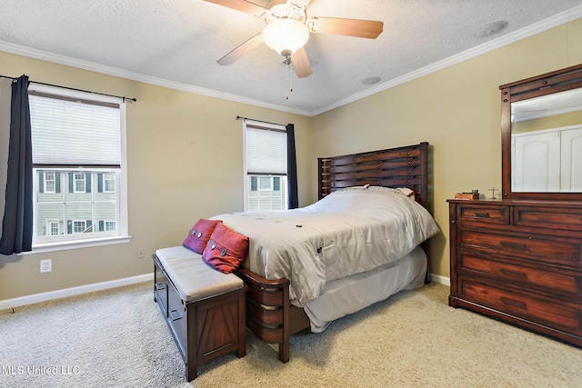 208 E Orchard Loop Unit 208, Diberville, MS 39540 - bedroom featuring crown molding, light carpet, a textured ceiling, and a ceiling fan