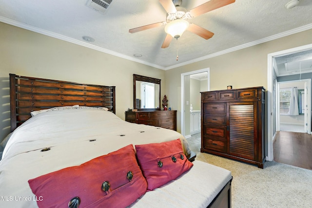 208 E Orchard Loop Unit 208, Diberville, MS 39540 - bedroom with attic access, crown molding, light carpet, a ceiling fan, and connected bathroom