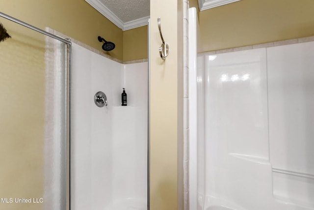 208 E Orchard Loop Unit 208, Diberville, MS 39540 - bathroom featuring a shower, ornamental molding, and a textured ceiling