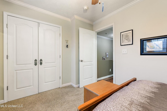 208 E Orchard Loop Unit 208, Diberville, MS 39540 - bedroom featuring crown molding, a closet, and a ceiling fan