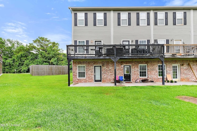 208 E Orchard Loop Unit 208, Diberville, MS 39540 - back of house with a wooden deck, a lawn, a patio, and brick siding