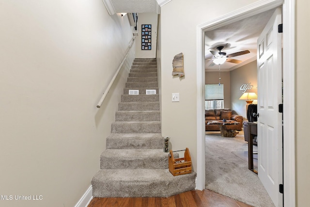 208 E Orchard Loop Unit 208, Diberville, MS 39540 - stairs featuring a ceiling fan and wood finished floors