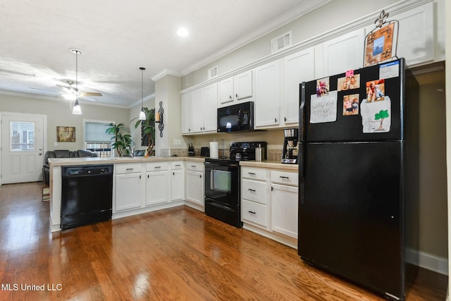 208 E Orchard Loop Unit 208, Diberville, MS 39540 - kitchen featuring black appliances, white cabinetry, light countertops, ornamental molding, and open floor plan