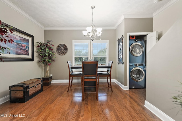 208 E Orchard Loop Unit 208, Diberville, MS 39540 - dining area with stacked washing machine and dryer, a chandelier, wood finished floors, and crown molding