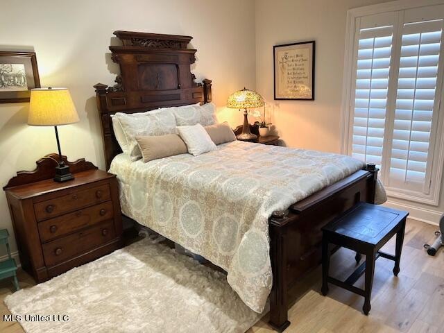 bedroom with light hardwood / wood-style floors