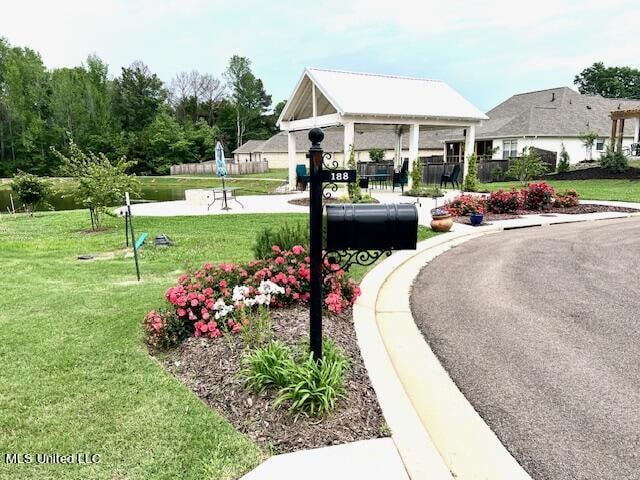 view of community featuring a gazebo and a yard