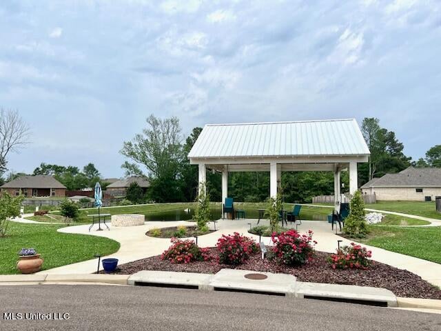 view of home's community with a gazebo, a yard, and a patio