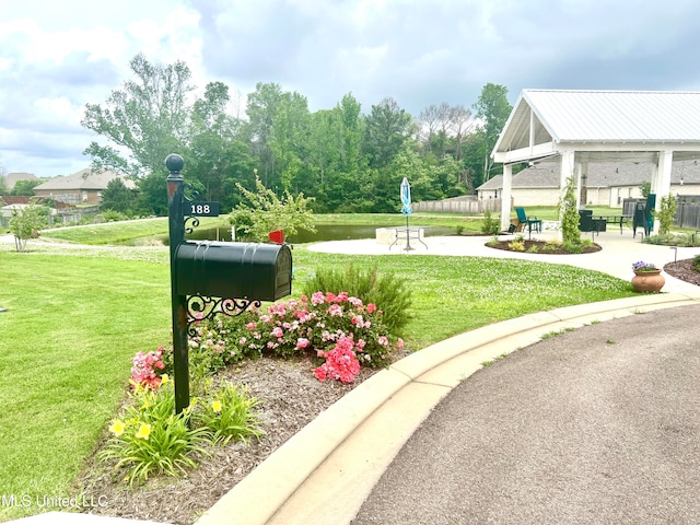 view of property's community featuring a gazebo and a lawn