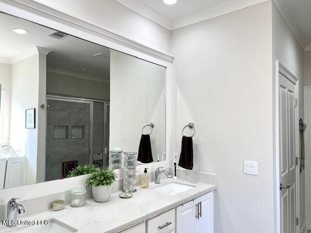 bathroom featuring vanity, an enclosed shower, and ornamental molding