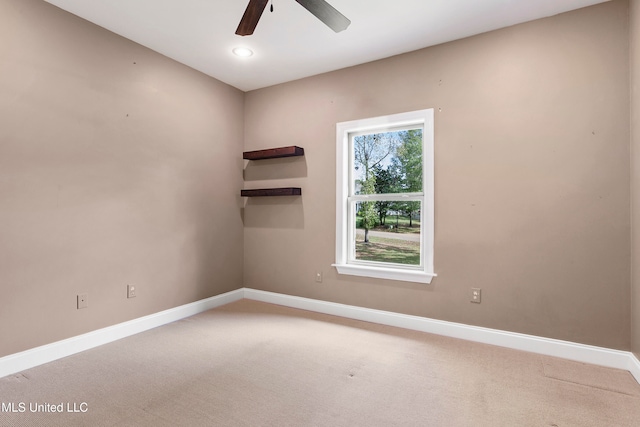 carpeted empty room with ceiling fan