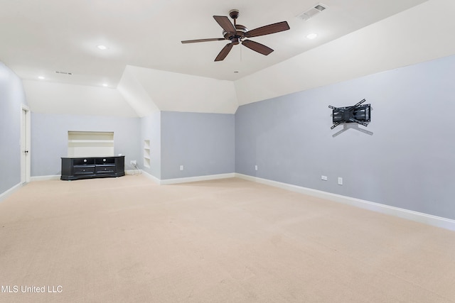 bonus room with ceiling fan, light colored carpet, and vaulted ceiling