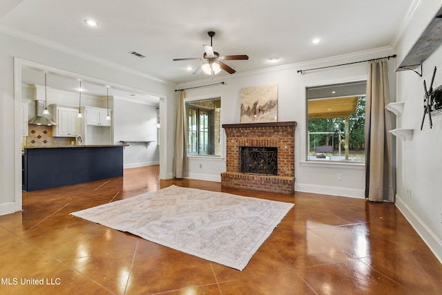 living room with a wealth of natural light, crown molding, and ceiling fan