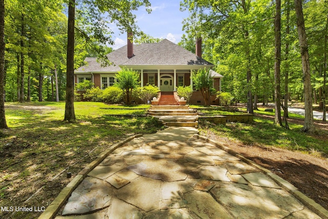 169 Pine Hill Dr, Brandon, MS 39047 - view of front of home featuring covered porch, a chimney, and roof with shingles