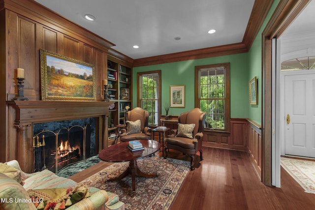 169 Pine Hill Dr, Brandon, MS 39047 - living area featuring wainscoting, crown molding, dark wood-type flooring, a high end fireplace, and recessed lighting