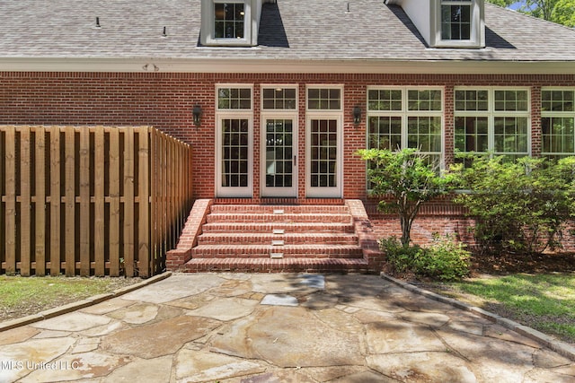 169 Pine Hill Dr, Brandon, MS 39047 - property entrance featuring a shingled roof and brick siding