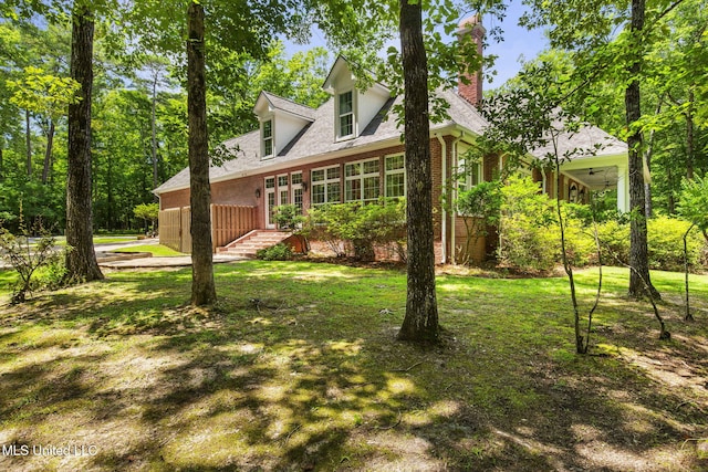 169 Pine Hill Dr, Brandon, MS 39047 - view of side of home featuring brick siding, a chimney, a yard, and a shingled roof