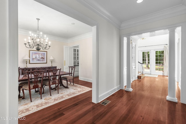 169 Pine Hill Dr, Brandon, MS 39047 - dining space with ornate columns, wood finished floors, ornamental molding, and a chandelier