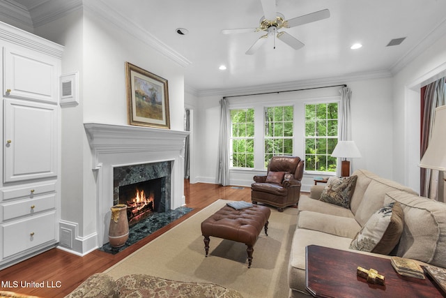 169 Pine Hill Dr, Brandon, MS 39047 - living room featuring dark wood finished floors, a ceiling fan, a premium fireplace, recessed lighting, and crown molding