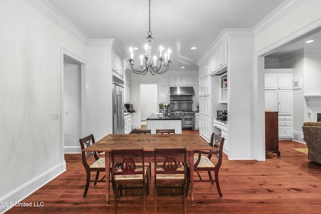 169 Pine Hill Dr, Brandon, MS 39047 - dining area with a chandelier, recessed lighting, dark wood-style flooring, ornamental molding, and a fireplace