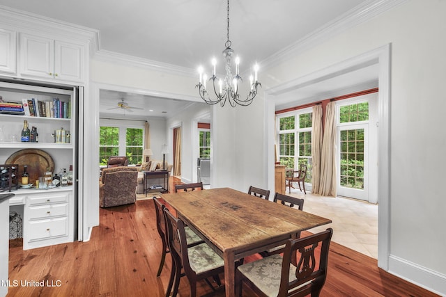 169 Pine Hill Dr, Brandon, MS 39047 - dining space featuring ornamental molding, wood finished floors, a chandelier, a ceiling fan, and bar area