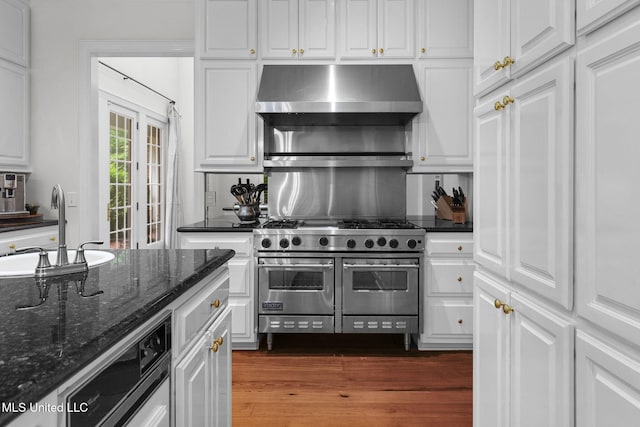 169 Pine Hill Dr, Brandon, MS 39047 - kitchen with extractor fan, double oven range, white cabinets, and dark wood-style flooring