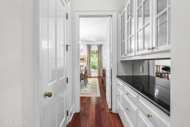 169 Pine Hill Dr, Brandon, MS 39047 - bar area featuring ornamental molding and dark wood-type flooring