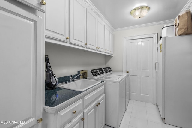 169 Pine Hill Dr, Brandon, MS 39047 - laundry room with independent washer and dryer, cabinet space, light tile patterned floors, and ornamental molding