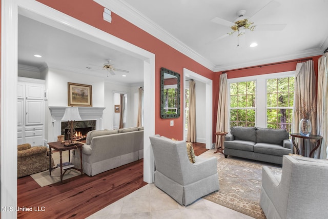 169 Pine Hill Dr, Brandon, MS 39047 - living room featuring a ceiling fan, a premium fireplace, crown molding, recessed lighting, and wood finished floors