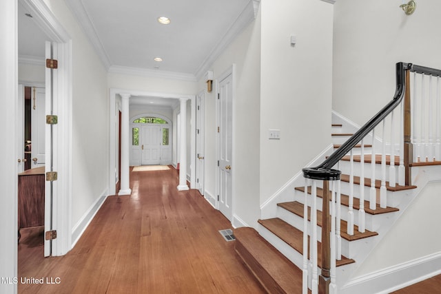 169 Pine Hill Dr, Brandon, MS 39047 - hall featuring ornate columns, recessed lighting, wood finished floors, stairway, and crown molding