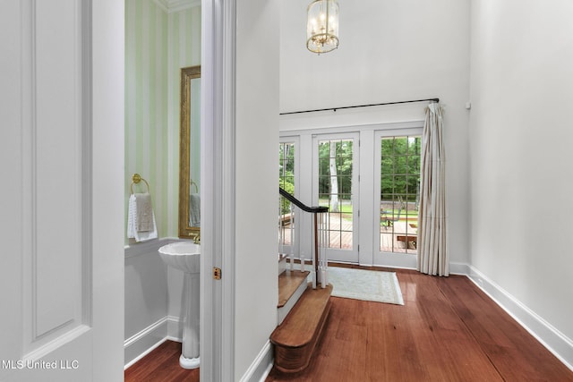 169 Pine Hill Dr, Brandon, MS 39047 - doorway to outside featuring stairway, wood finished floors, and a chandelier