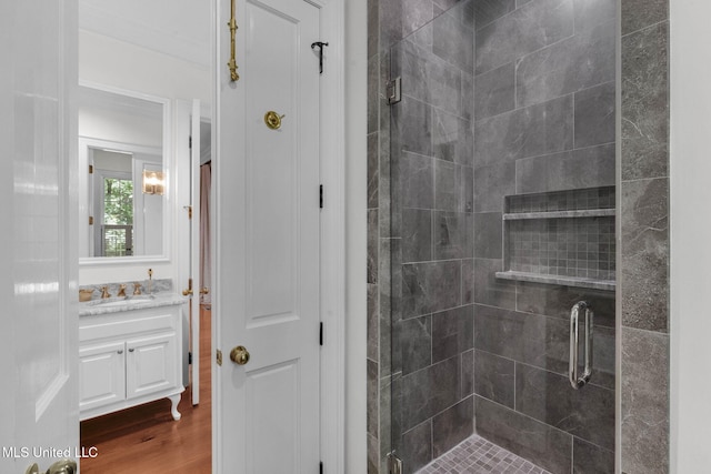 169 Pine Hill Dr, Brandon, MS 39047 - full bathroom featuring vanity, a stall shower, and wood finished floors