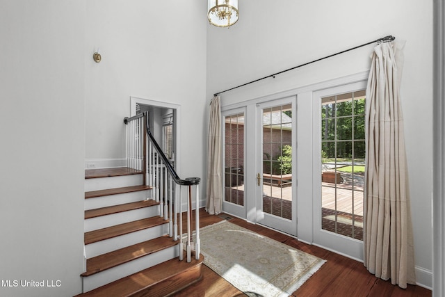 169 Pine Hill Dr, Brandon, MS 39047 - foyer entrance with wood finished floors, stairs, french doors, and a towering ceiling