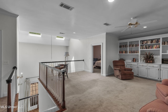 169 Pine Hill Dr, Brandon, MS 39047 - sitting room featuring an upstairs landing, light carpet, ceiling fan, recessed lighting, and crown molding