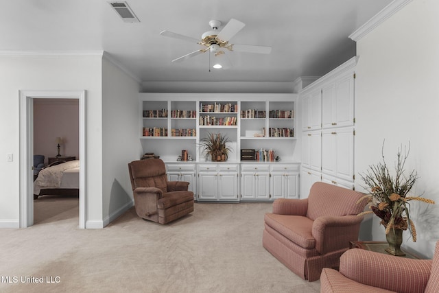 169 Pine Hill Dr, Brandon, MS 39047 - living area with light colored carpet, a ceiling fan, and ornamental molding