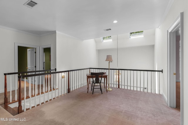 169 Pine Hill Dr, Brandon, MS 39047 - corridor with carpet floors, a skylight, ornamental molding, an upstairs landing, and recessed lighting