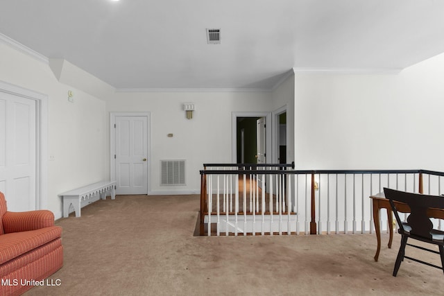 169 Pine Hill Dr, Brandon, MS 39047 - living area with ornamental molding, carpet floors, and an upstairs landing