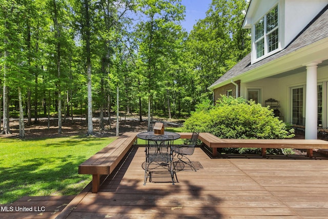 169 Pine Hill Dr, Brandon, MS 39047 - wooden terrace with a lawn and outdoor dining area