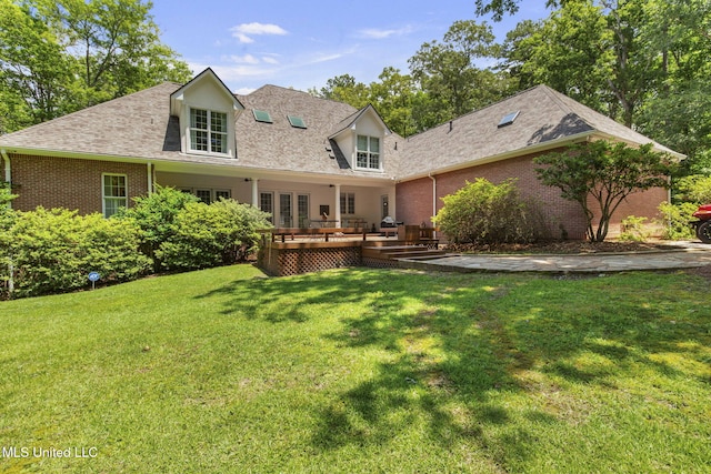 169 Pine Hill Dr, Brandon, MS 39047 - back of property featuring a lawn, roof with shingles, brick siding, and a wooden deck