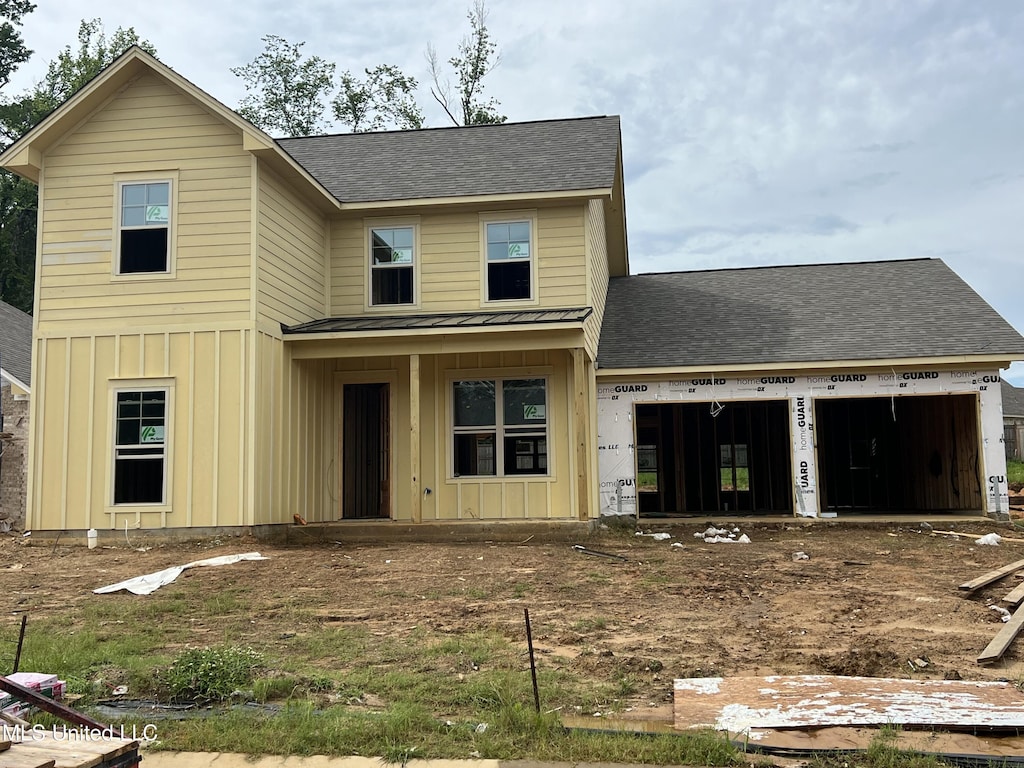 615 Cobalt Way, Brandon, MS 39042 - view of front of property featuring board and batten siding, a shingled roof, a garage, a standing seam roof, and a metal roof