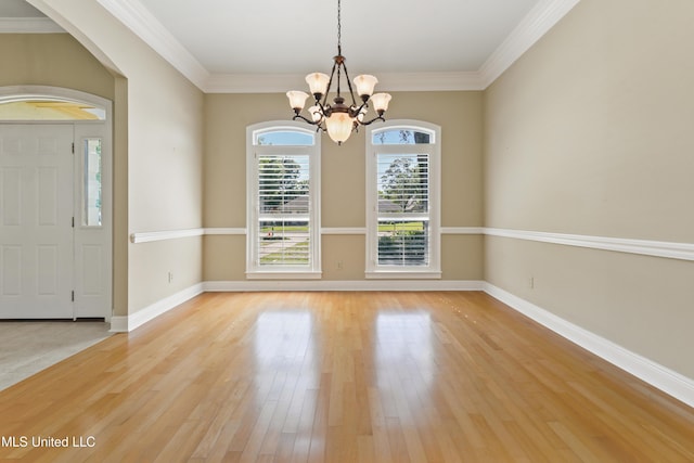 426 Carmargue Ln, Biloxi, MS 39531 - spare room with a chandelier, light wood finished floors, baseboards, and ornamental molding