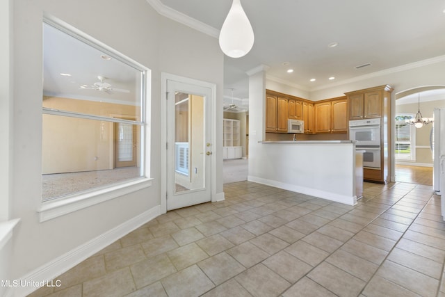 426 Carmargue Ln, Biloxi, MS 39531 - kitchen featuring white appliances, crown molding, light tile patterned floors, baseboards, and a ceiling fan