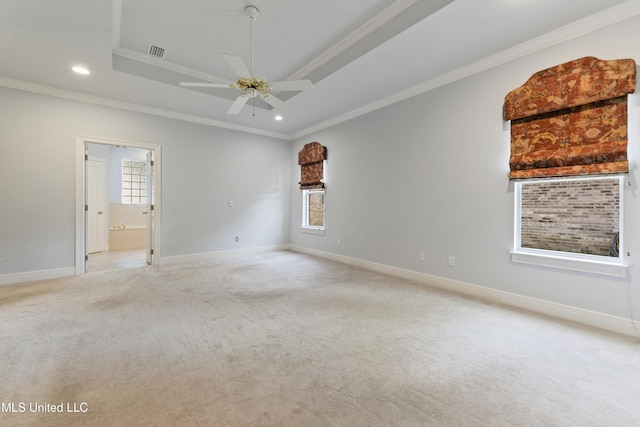 426 Carmargue Ln, Biloxi, MS 39531 - spare room with a tray ceiling, light colored carpet, baseboards, crown molding, and recessed lighting
