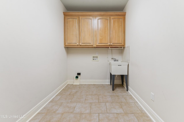 426 Carmargue Ln, Biloxi, MS 39531 - washroom with hookup for a washing machine, cabinet space, light tile patterned floors, baseboards, and hookup for an electric dryer