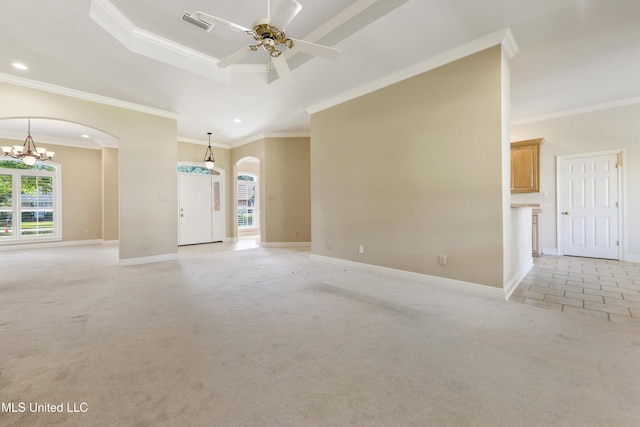 426 Carmargue Ln, Biloxi, MS 39531 - empty room featuring arched walkways, healthy amount of natural light, crown molding, a chandelier, and baseboards